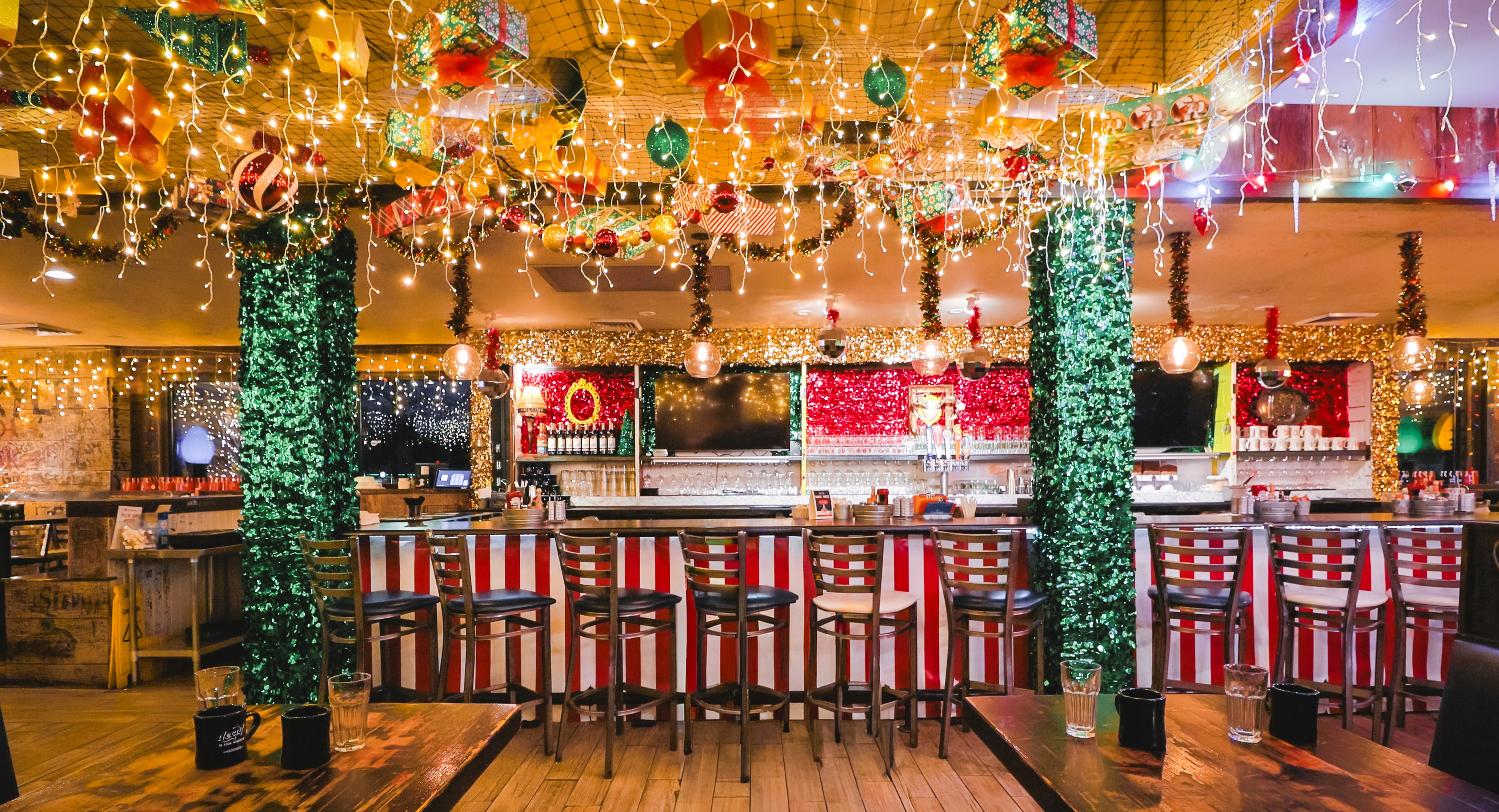Festive holiday lights and décor throughout the space
