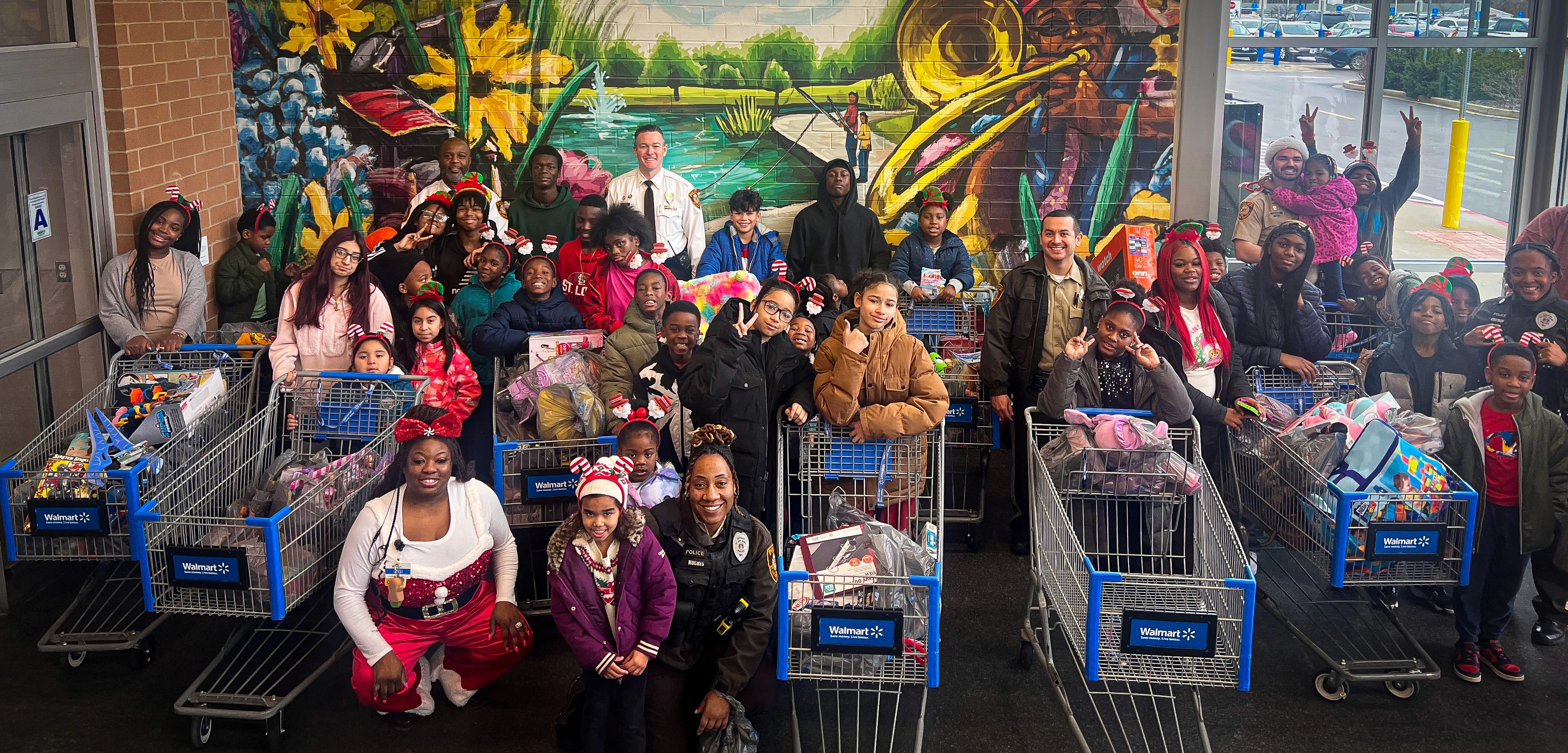 Shop With a Cop volunteers and families with full shopping carts