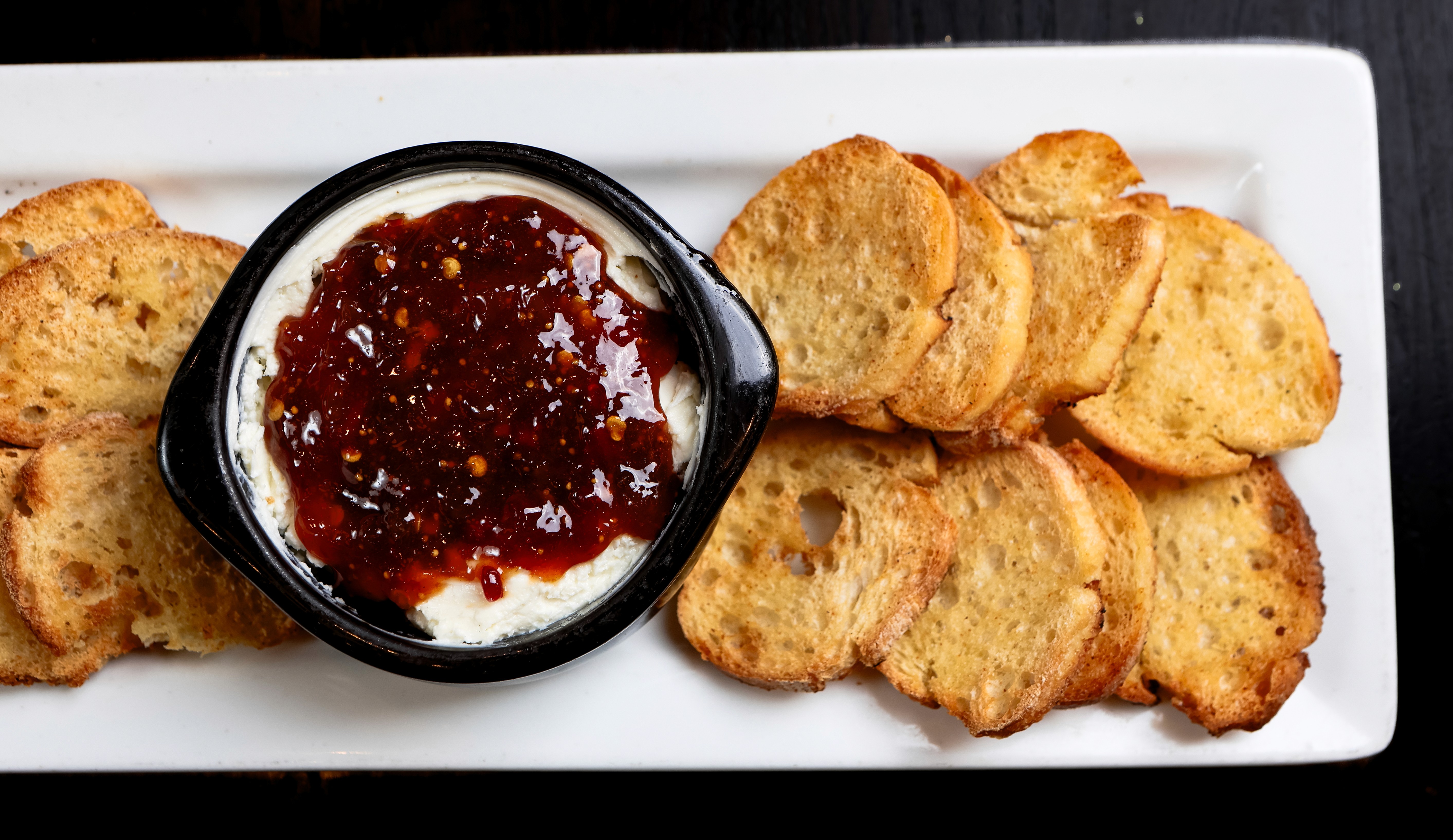 Whipped cheese with pepper jam and crostini
